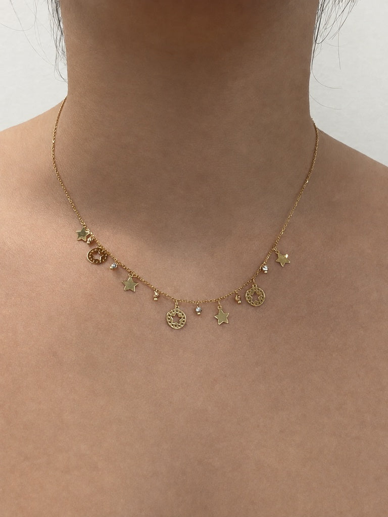 Cadena con estrellas colgantes y balines de oro blanco y oro rosado 14k