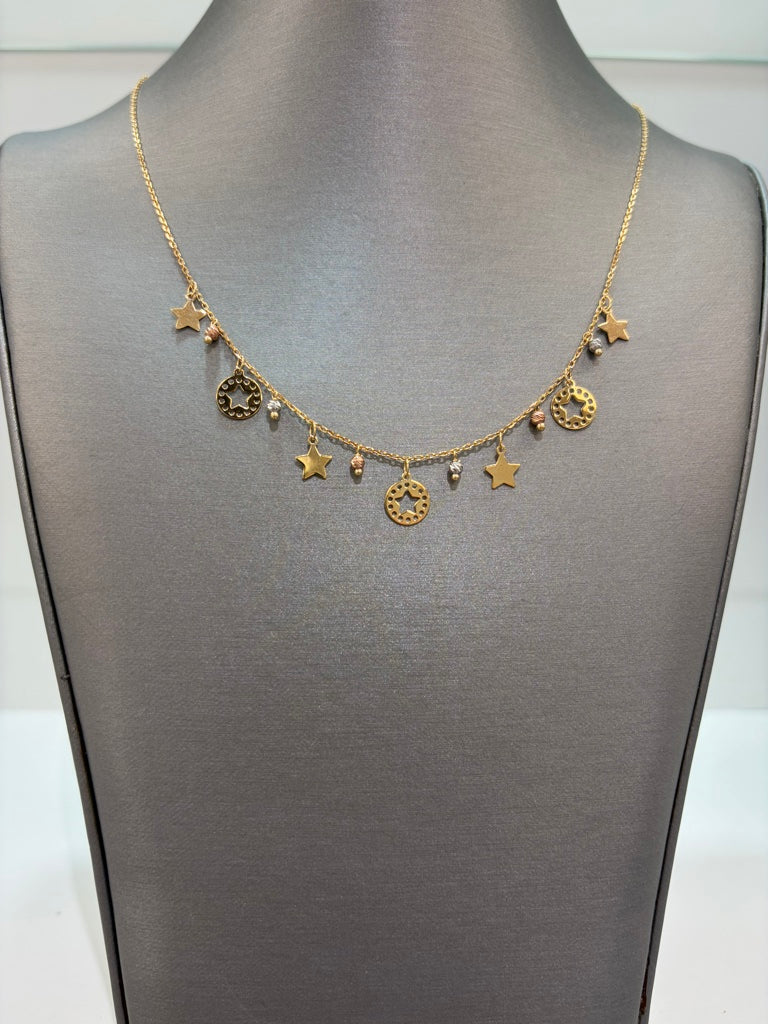 Cadena con estrellas colgantes y balines de oro blanco y oro rosado 14k