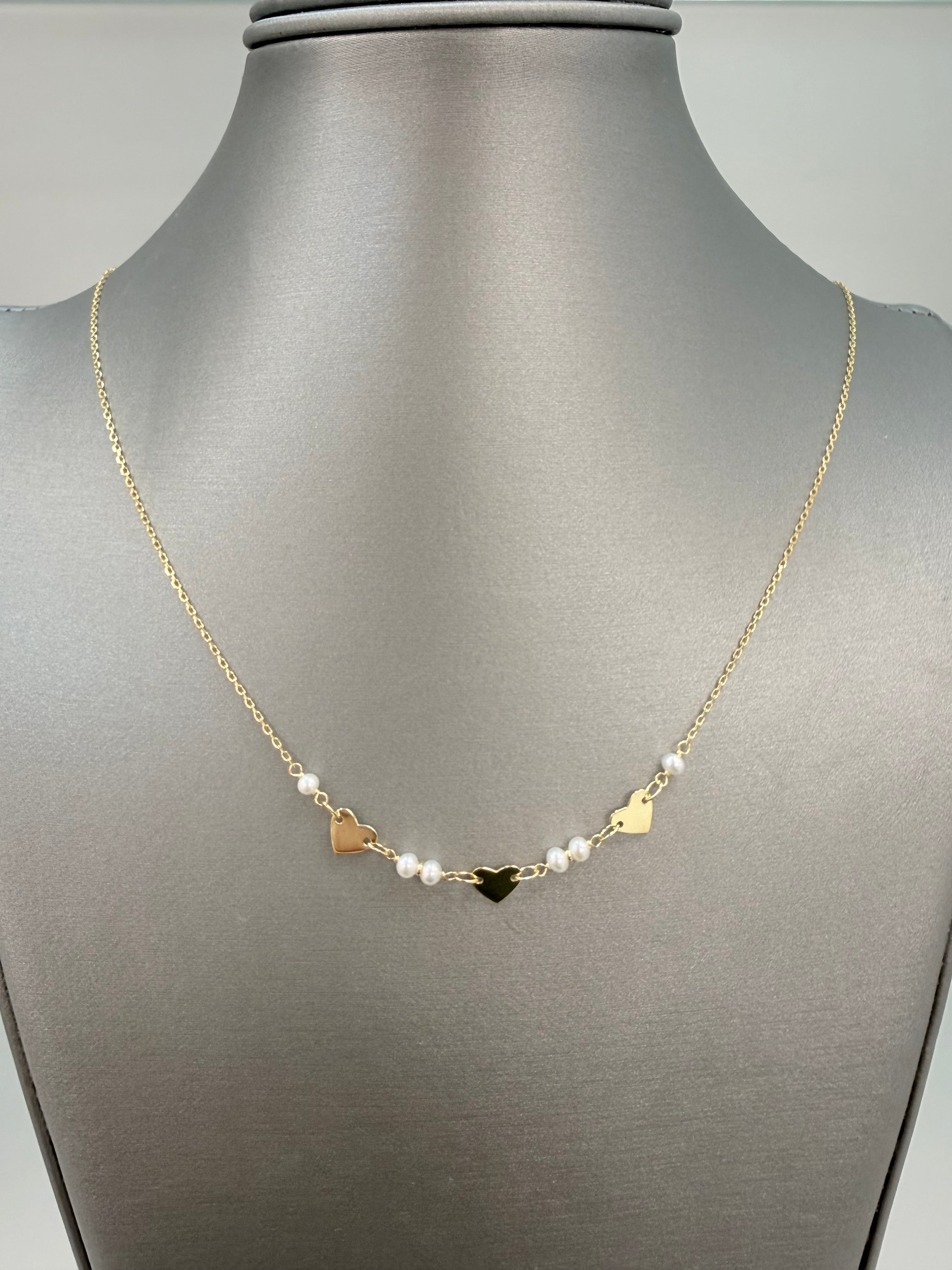 Cadena solida de corazones y perlas naturales de río en oro de 14 kt
