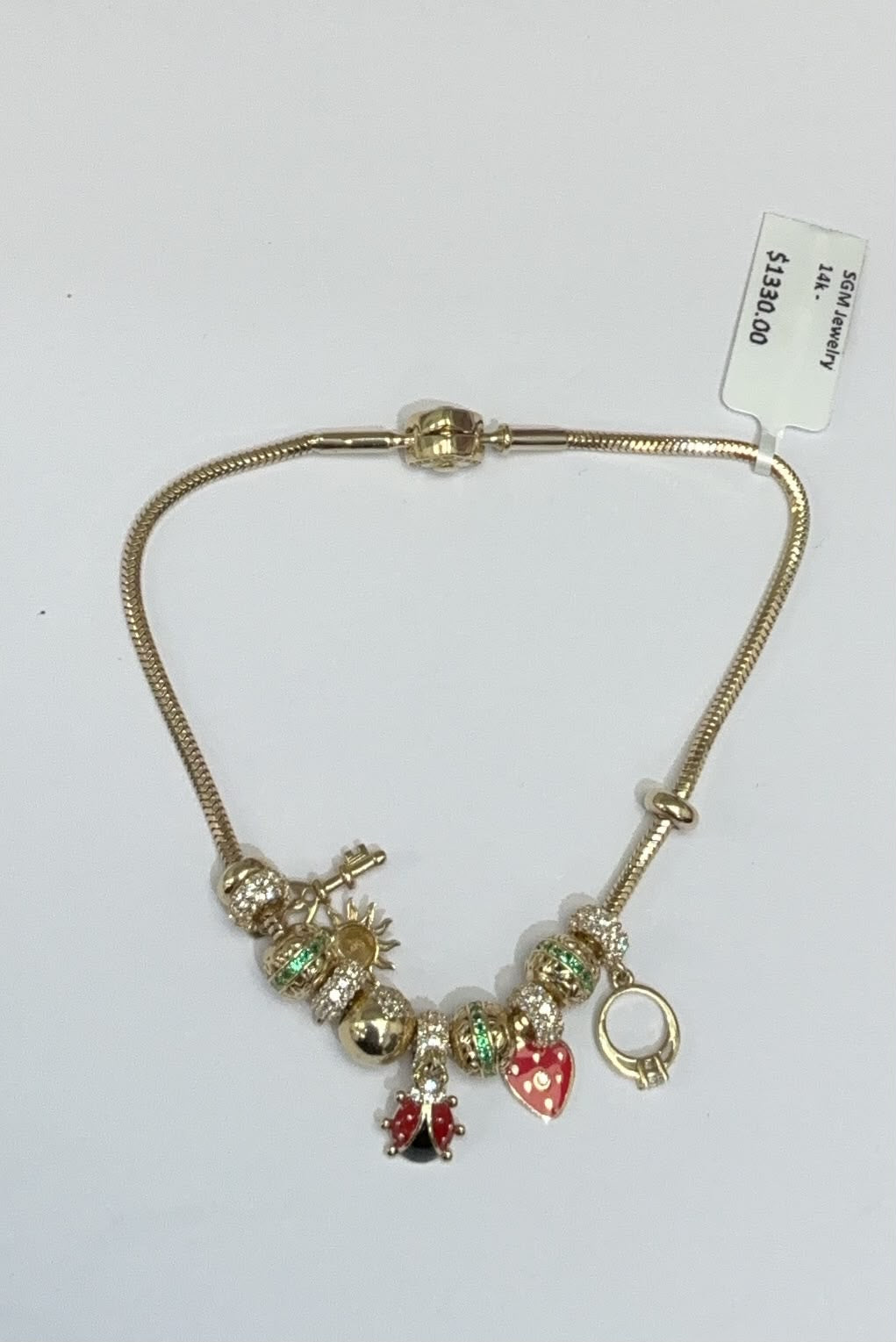 Pulsera estilo pando con 9 charm y 2
separadores 14k
