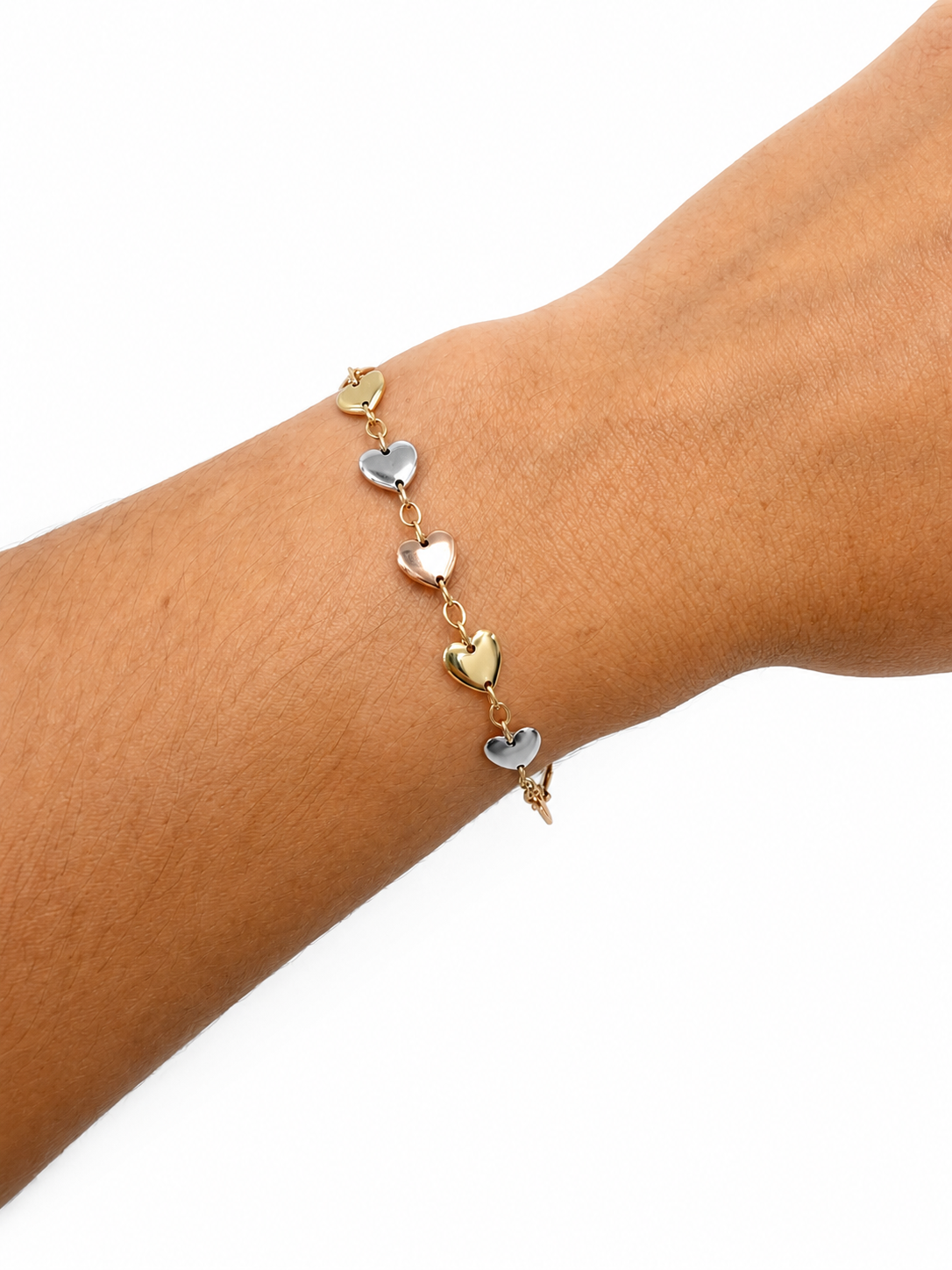 Pulsera solida con corazones inflados en oro blanco,amarillo y rosado en 14 kt