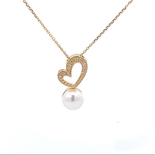 Cadena de corazón de diamantes y perla natural de rio en oro amarillo de 14 kt !!