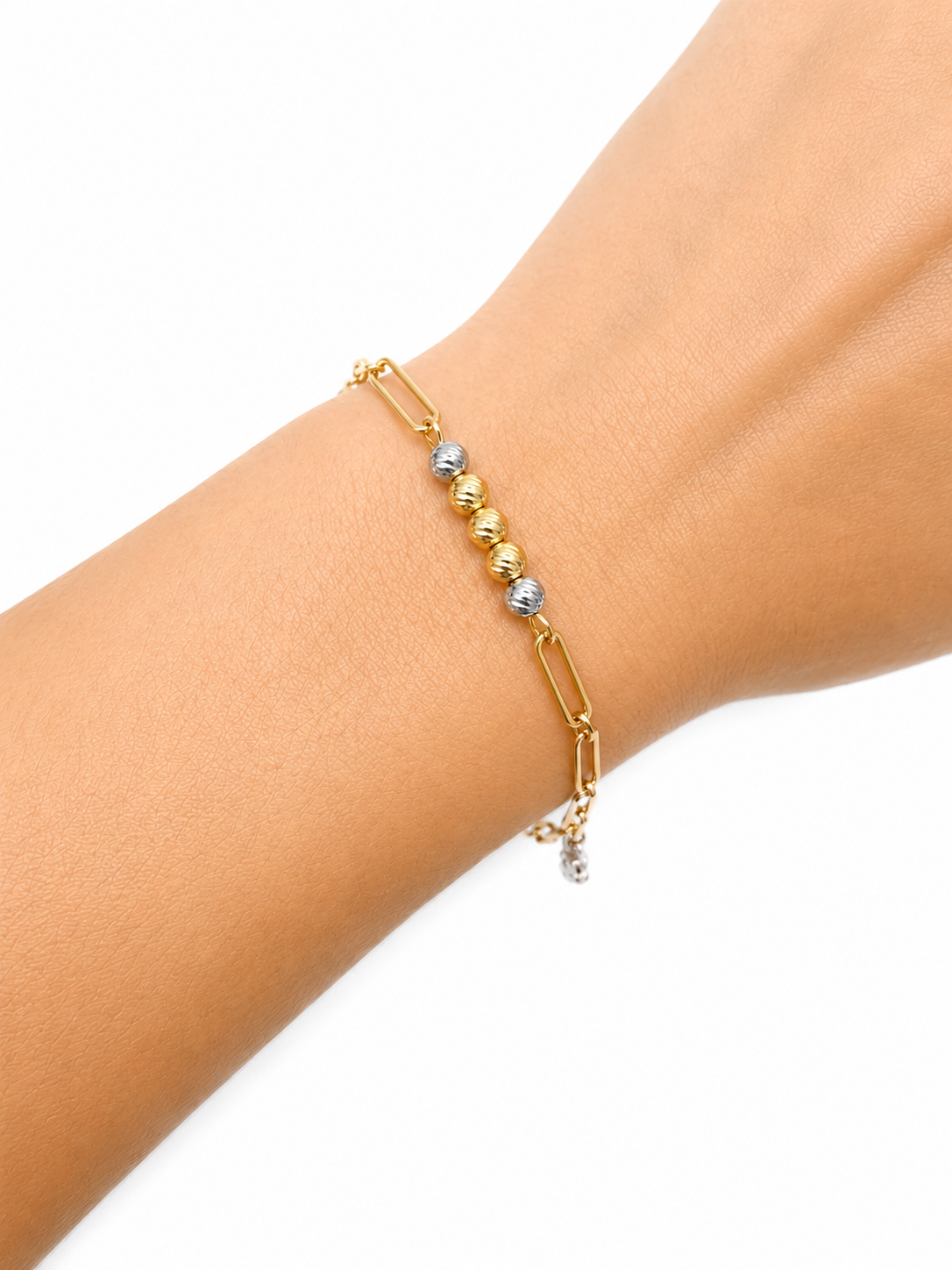 Pulsera paperclip y balines en oro blanco y amarillo de 14 kt