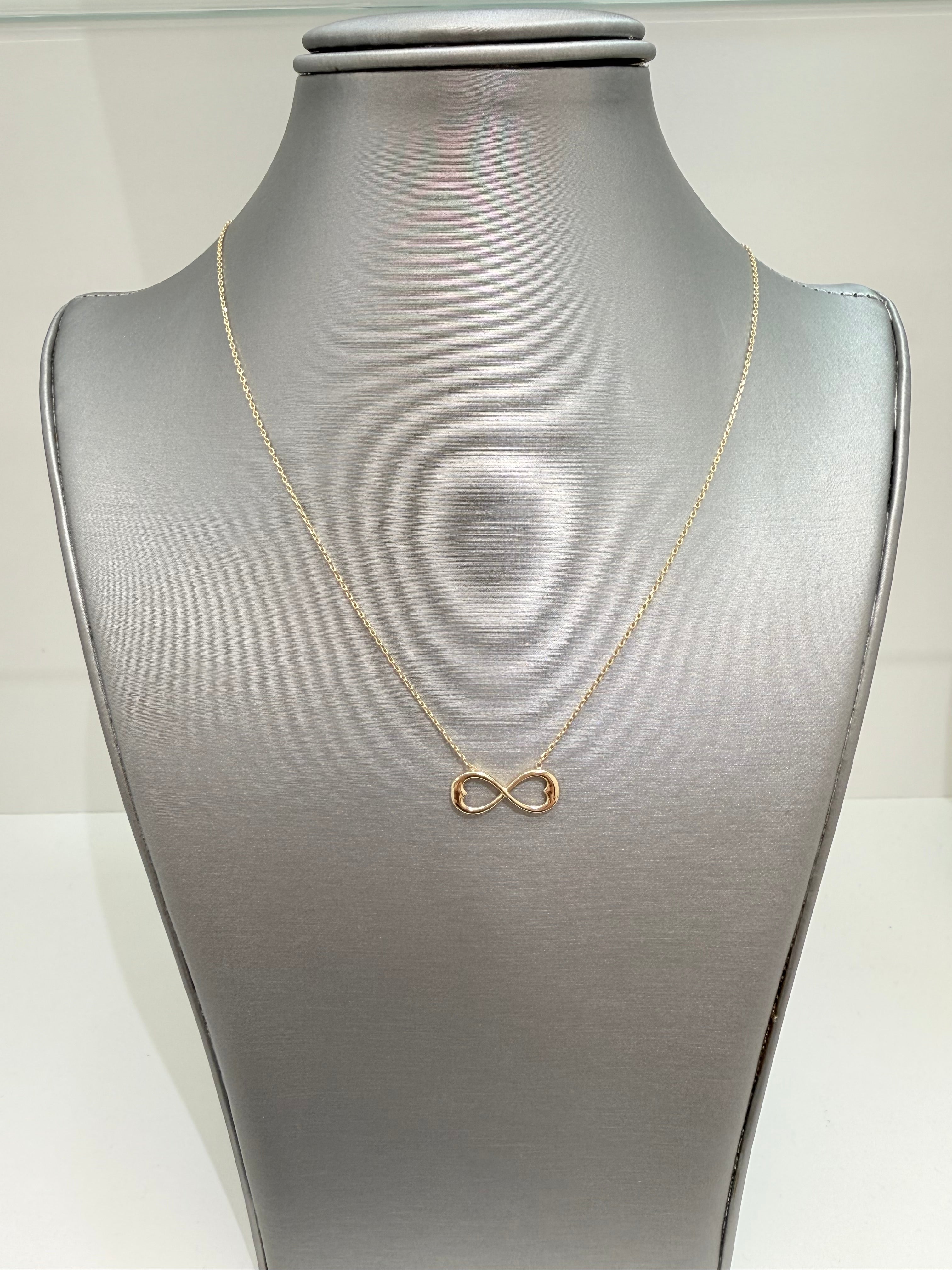 Cadena solida de 14 kt con dije de infinito