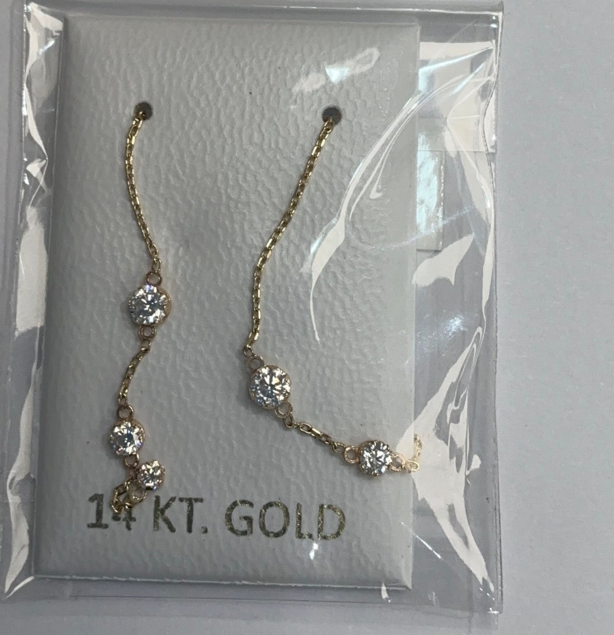 Aretes voladores con zirconia en 14k