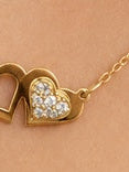 cadena fina con dos corazones y un corazon con circonia